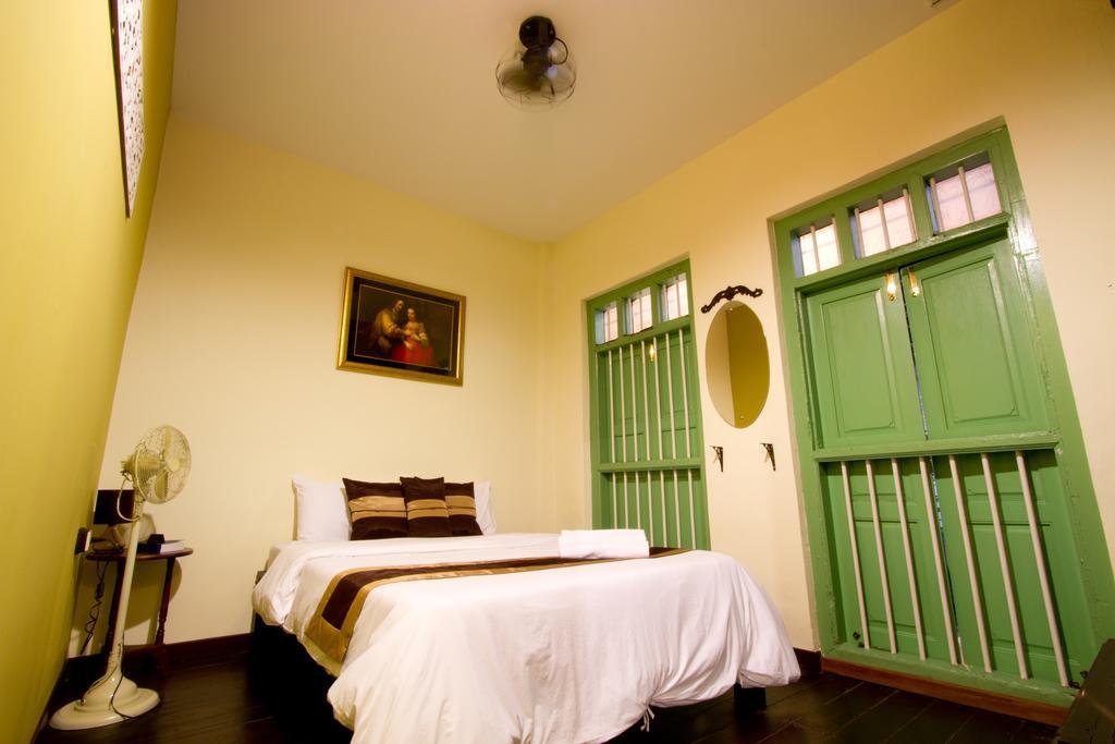 Luang Poj Boutique Hostel Ranong Værelse billede